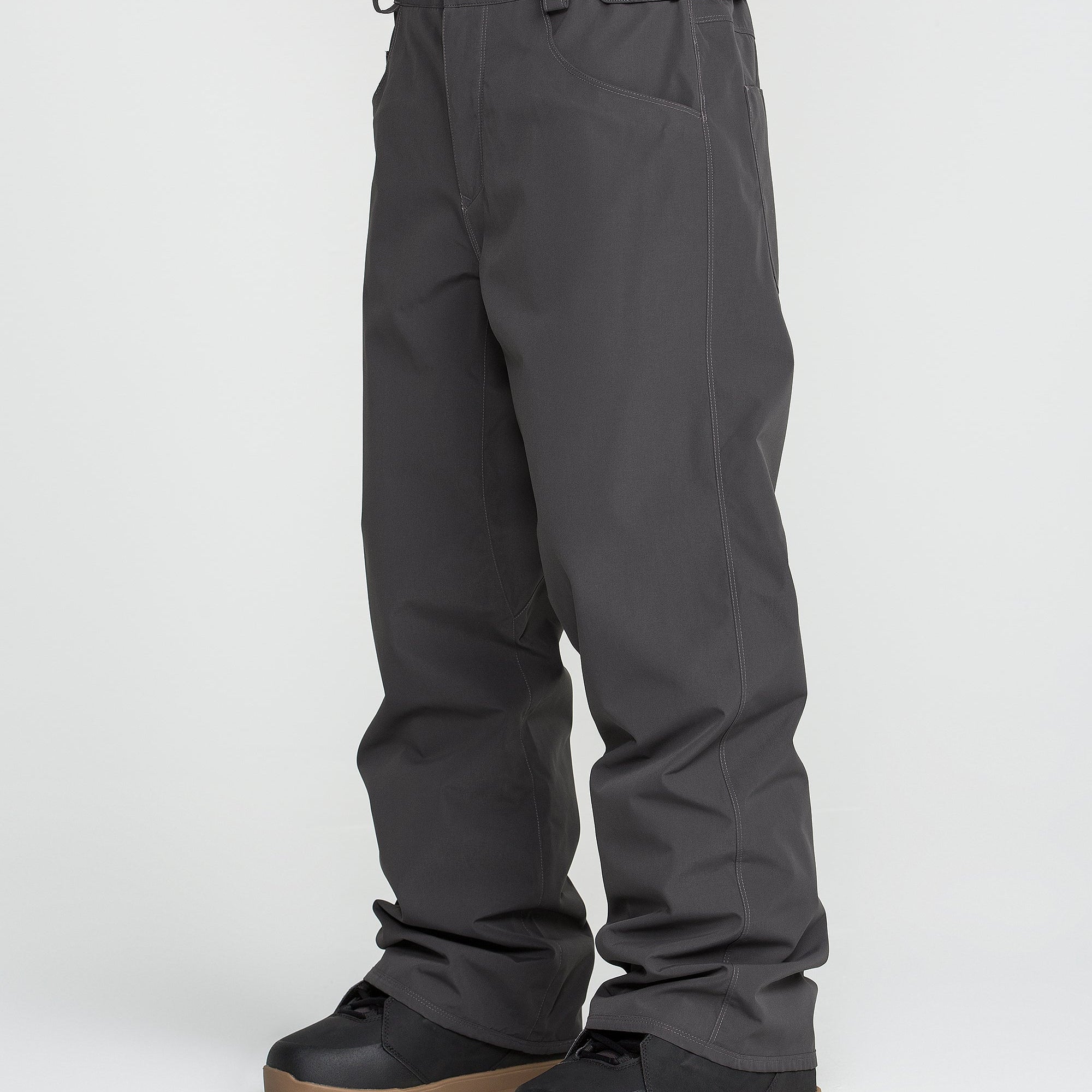 Dark grey snow pants with cuff straps and belt loops