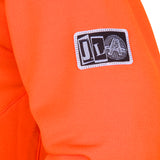 Volcom Men's Hydro Riding Hoodie 2025 - A bright orange hoodie with a white logo on the chest and a small tag near the bottom hem.