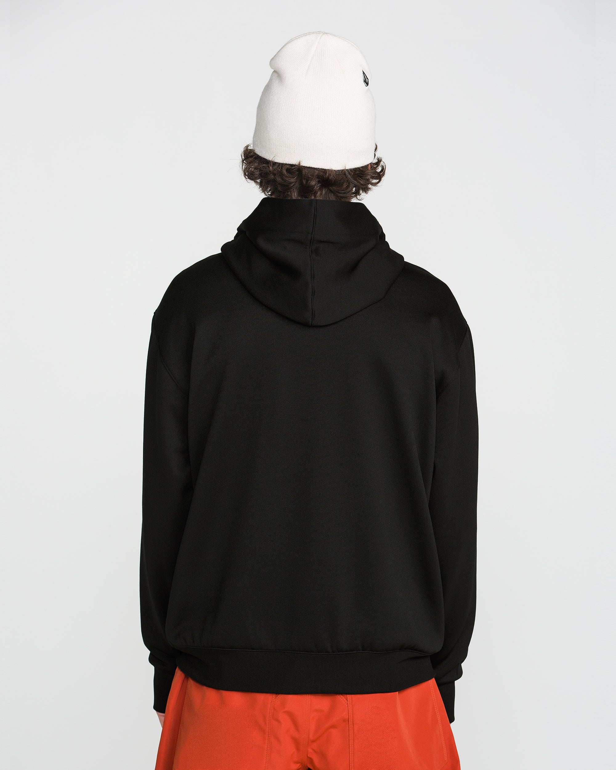 Black pullover hoodie with raised hood, no front graphic, back view