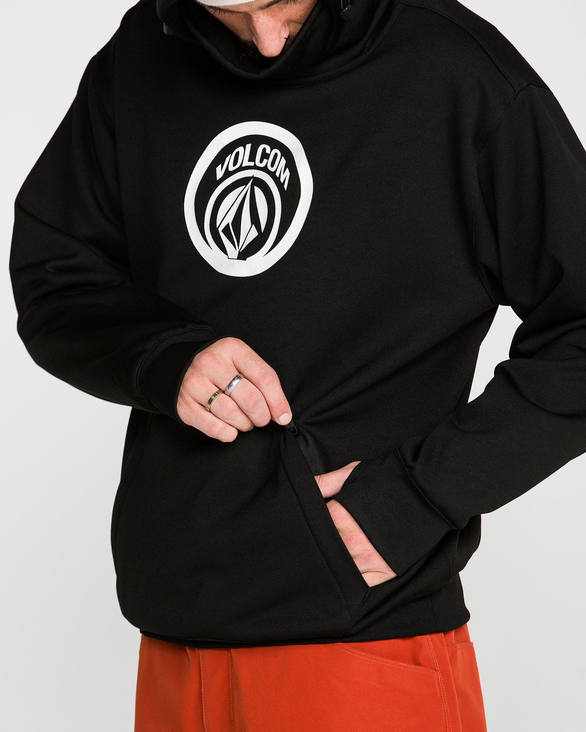 Black pullover hoodie with circular chest logo and kangaroo pocket opening