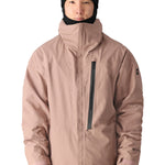 The 686 Gore-Tex GT Shell Jacket 2025 is primarily light pink with a black BOA dial on the right sleeve.