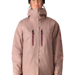 The 686 Women's GORE-TEX Skyline Shell Jacket 2025 is shown from the front in a dusty pink color with a high collar and zippered pockets.