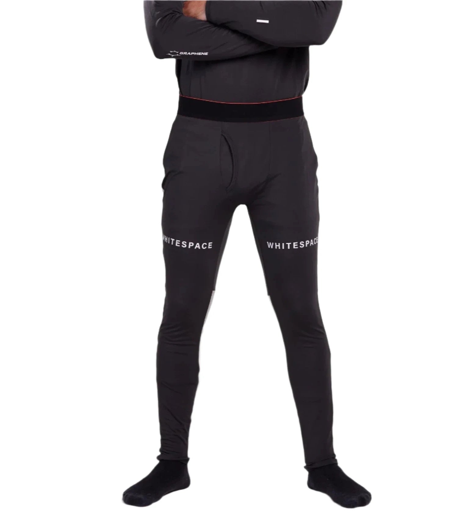 Whitespace Graphene Midweight Base Layer Bottom 2024 - A man wearing black base layer bottoms with a red stripe at the waistband and white lettering that reads "Graphene" on the left leg.