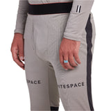 Whitespace Graphene Midweight Base Layer Bottom 2024 - A pair of light gray base layer bottoms with a subtle horizontal stripe pattern and black trim along the waistband.