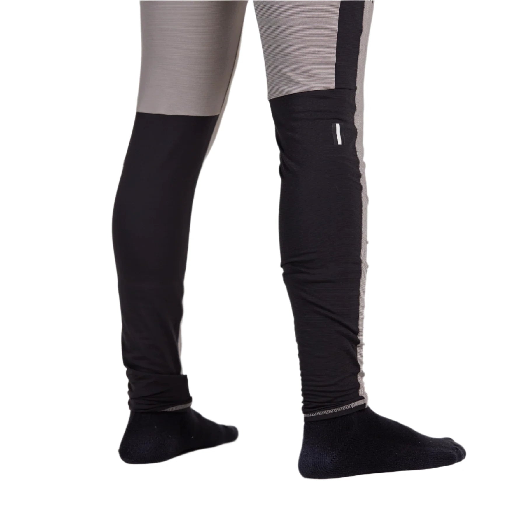Whitespace Graphene Midweight Base Layer Bottom 2024 - A pair of black base layer bottoms with a subtle gray stripe pattern on the side seam.