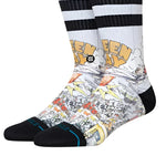 Stance x Green Day Basket Case Crew Sock 2024 - A pair of crew socks with a black and white striped pattern at the top, featuring a yellow "GREEN DAY" logo in bubble letters on the front.