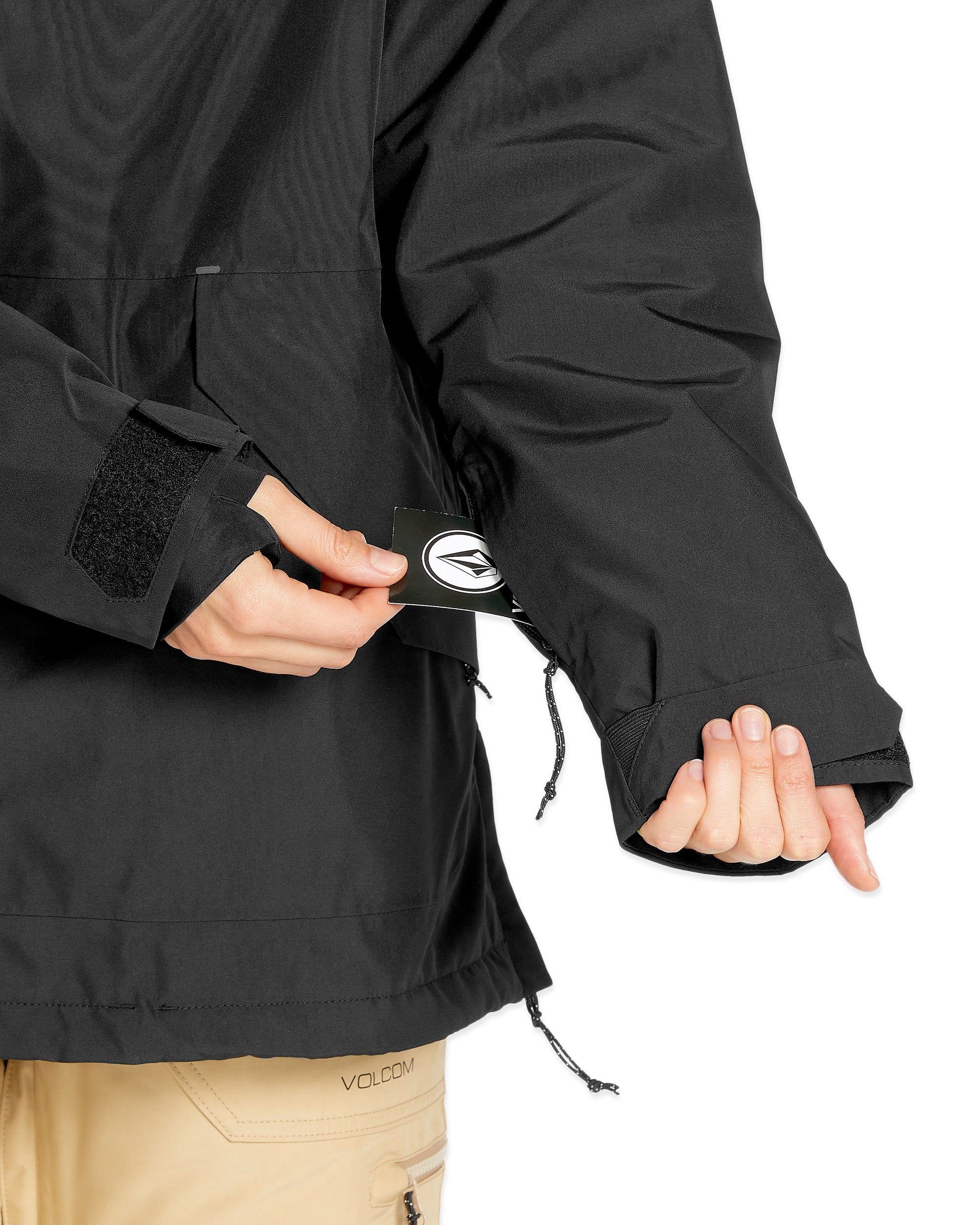 Volcom Women's Fern Insulated GORE-TEX Pullover - A black insulated jacket with a white logo on the left chest and a drawstring at the waist.