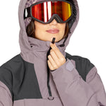 Volcom Women's Fern Insulated GORE-TEX Pullover - A purple and black insulated jacket with a hood, featuring a zipper closure and two pockets on the front.