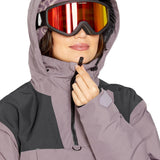 Volcom Women's Fern Insulated GORE-TEX Pullover - A purple and black insulated jacket with a hood, featuring a zipper closure and two pockets on the front.