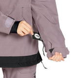 Volcom Women's Fern Insulated GORE-TEX Pullover - A woman's insulated jacket with a black and grey color scheme, featuring a hood and zippered pockets.