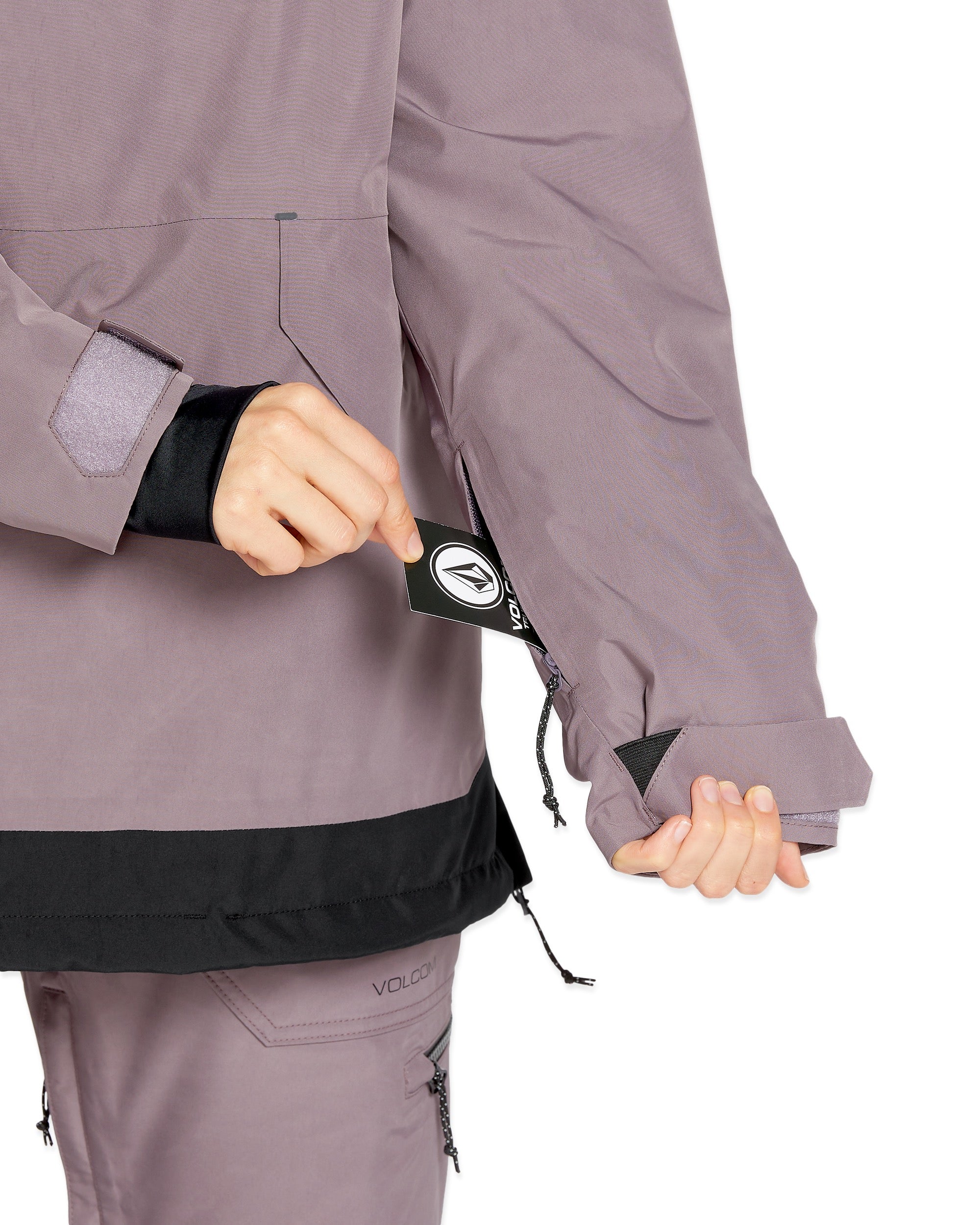 Volcom Women's Fern Insulated GORE-TEX Pullover - A woman's insulated jacket with a black and grey color scheme, featuring a hood and zippered pockets.