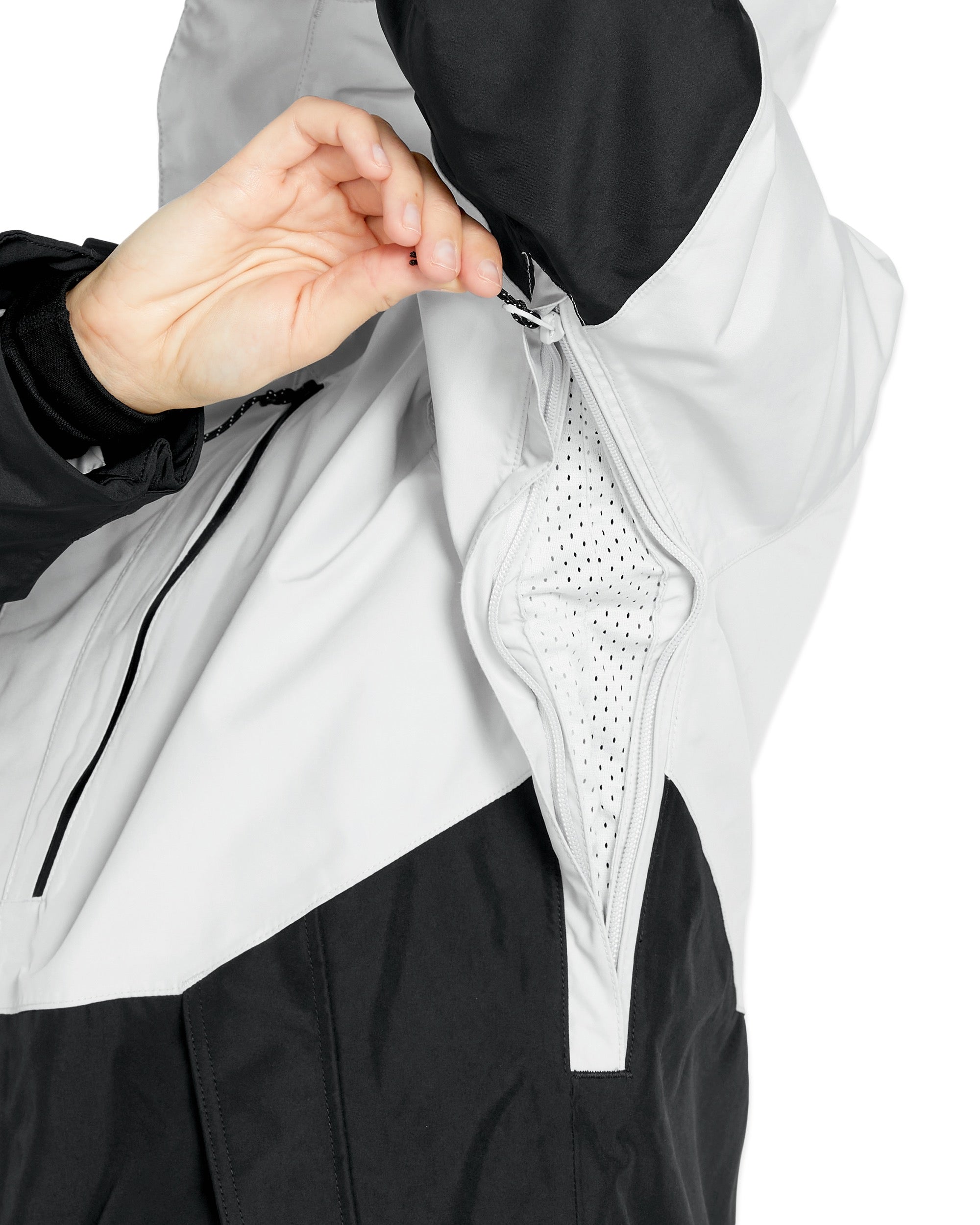 Volcom Women's V.Co Aris Insulated GORE-TEX Jacket - A black and white jacket with a zippered front, featuring a hood and two pockets on either side.