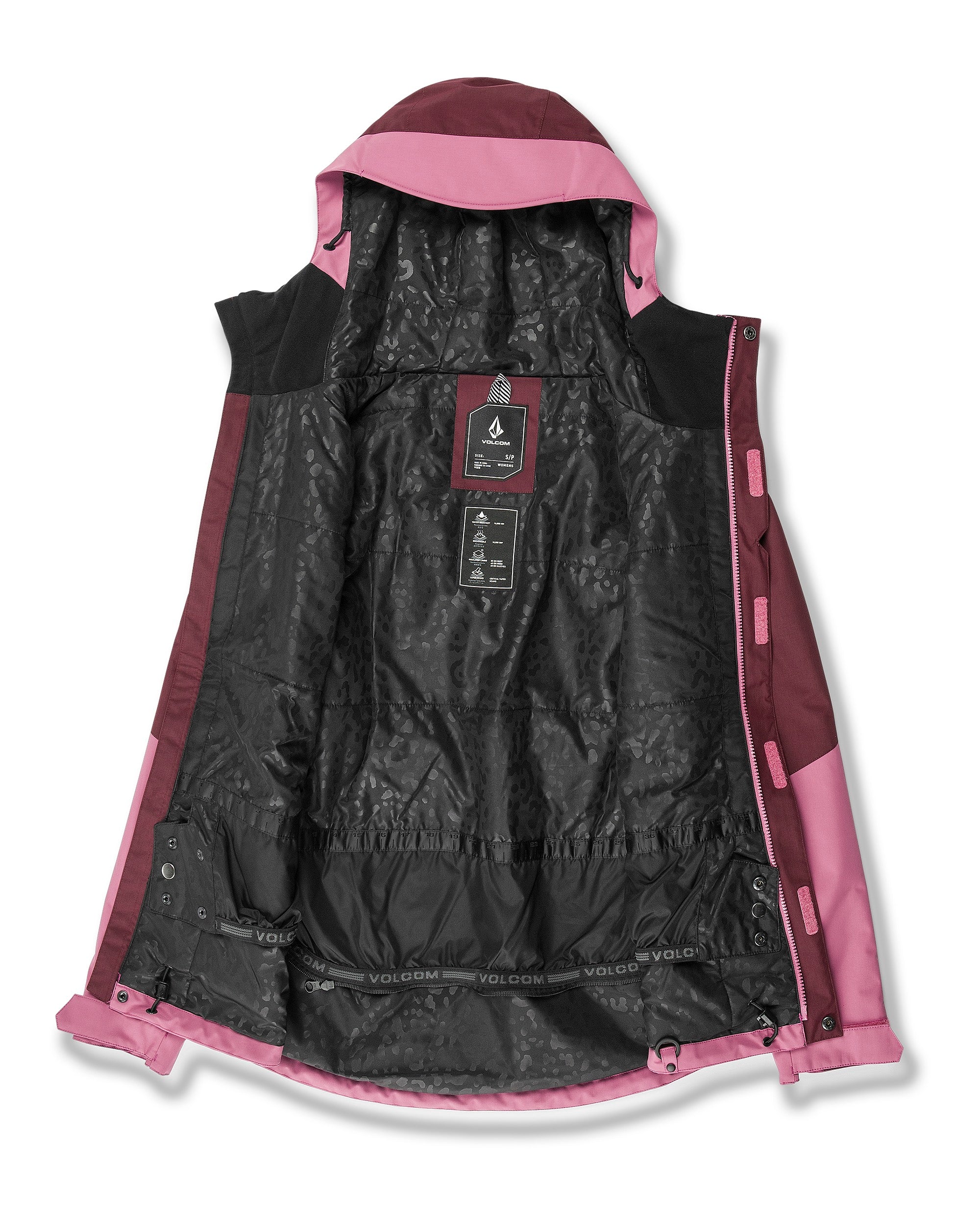 Volcom Women's Bolt Ins Jacket 2025 - A black jacket with a pink hood and accents, featuring a zippered front and two pockets on either side.