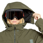 Volcom Women's Shiloh Snow Suit 2025 - Olive green snowsuit with a hood and two zippered pockets on the front.