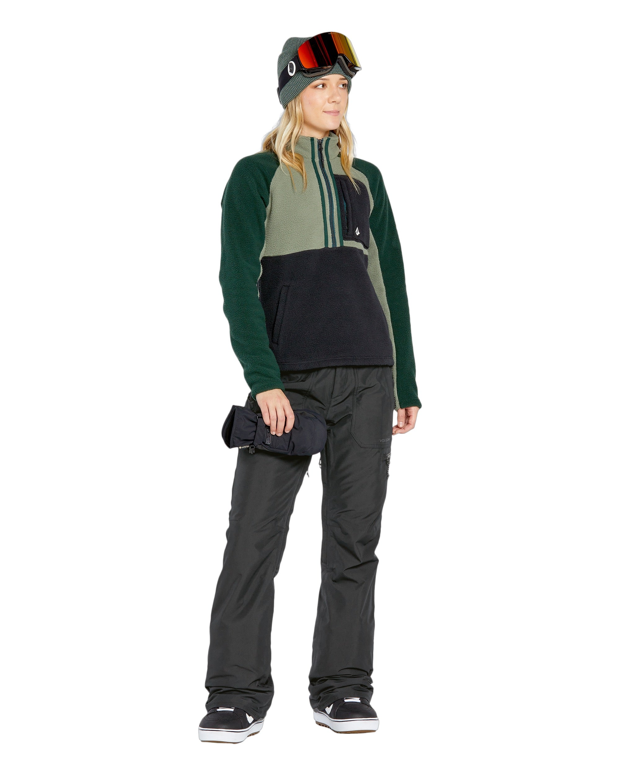 Volcom Women's Knox Insulated GORE-TEX Pant - A pair of black insulated ski pants with a zippered pocket on the thigh and a white logo on the left leg.