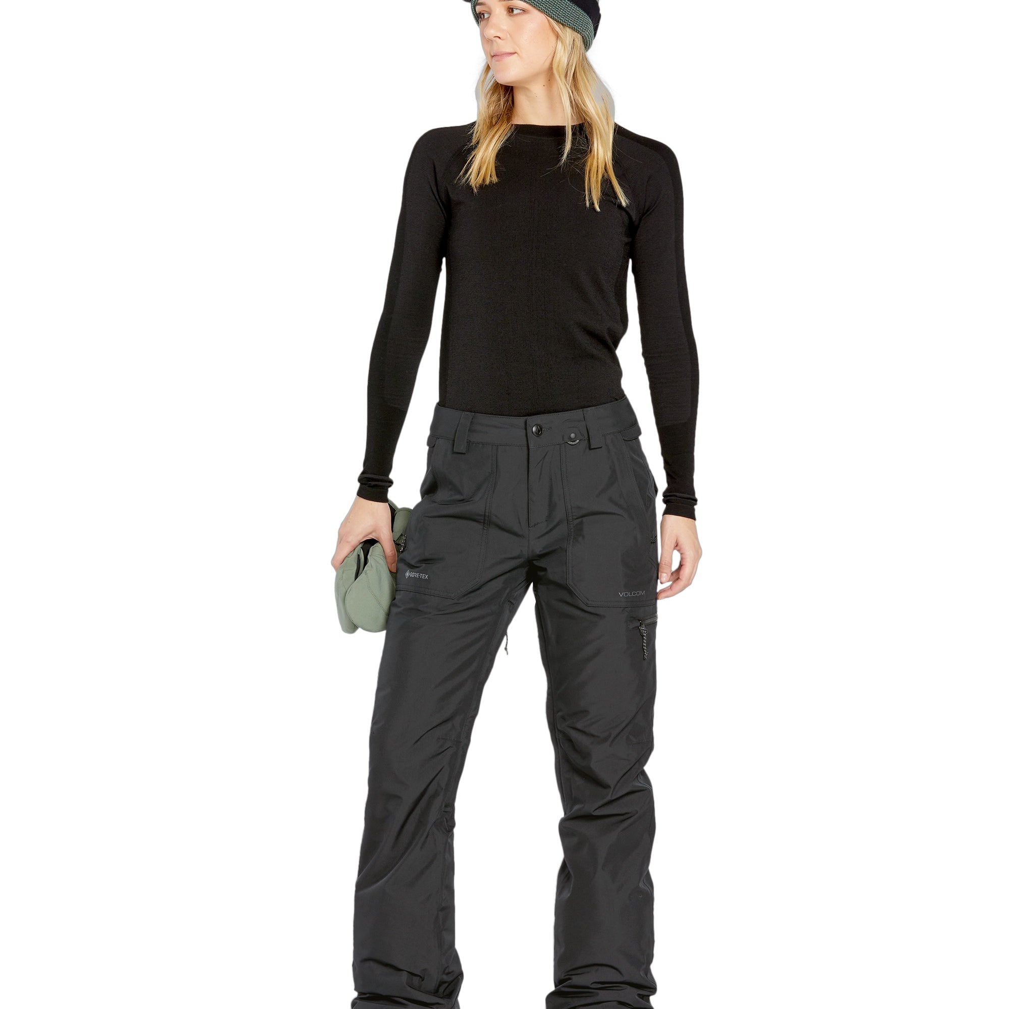 Volcom Women's Knox Insulated GORE-TEX Pant - A pair of black insulated ski pants with a zippered pocket on the thigh and a white logo on the left leg.