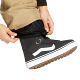 Volcom Women's Knox Insulated GORE-TEX Pant - A pair of black insulated ski pants with a subtle floral pattern on the lower leg, featuring a white logo on the left thigh and a zippered pocket on the right hip.