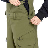 Volcom Women's Creston 3D Stretch Bib Overall - Olive green bib overalls with a zip front and adjustable straps.