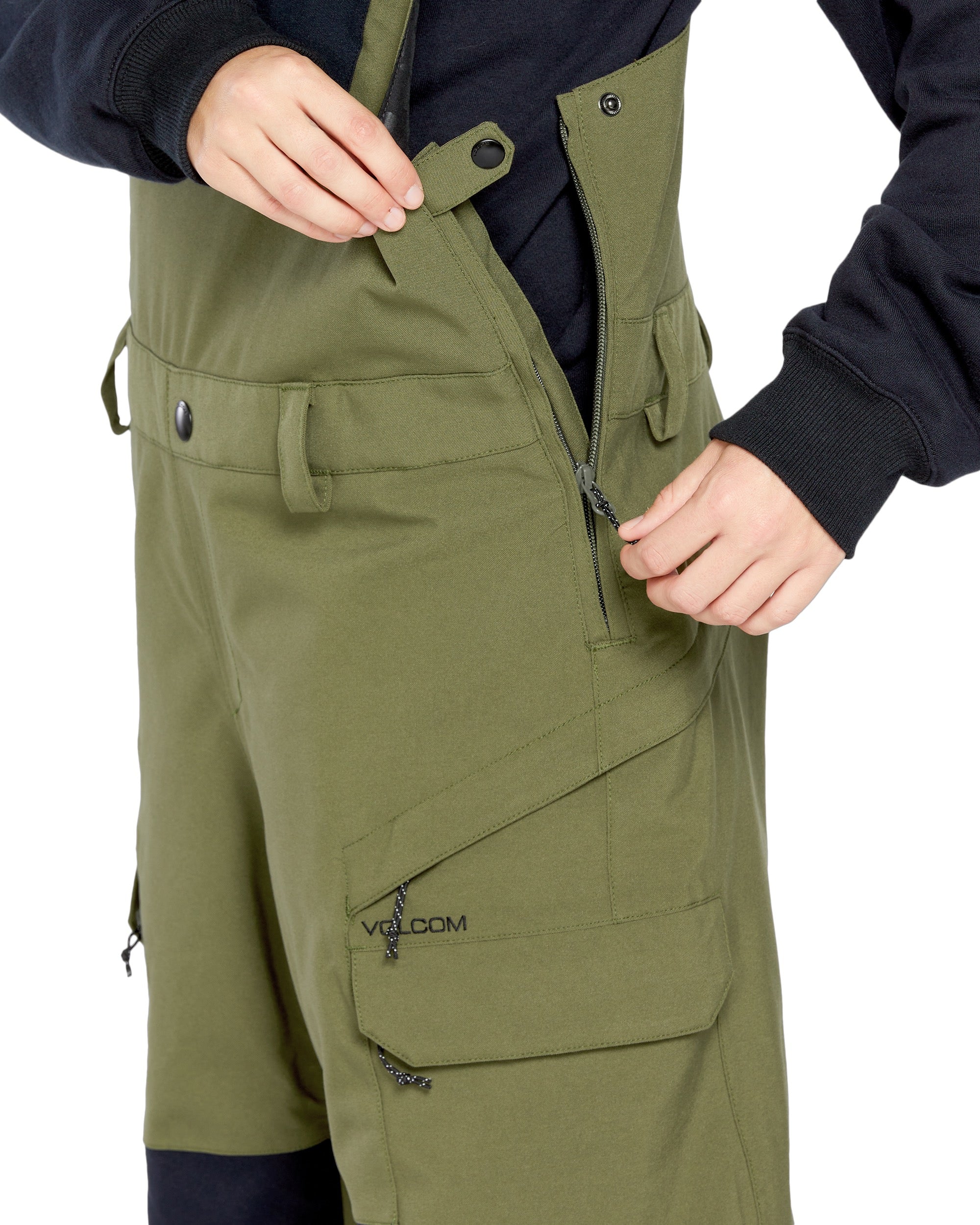 Volcom Women's Creston 3D Stretch Bib Overall - Olive green bib overalls with a zip front and adjustable straps.