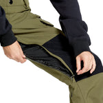 Volcom Women's Creston 3D Stretch Bib Overall - Olive green bib overalls with a black waistband and belt loops, featuring a zip fly and button front closure.