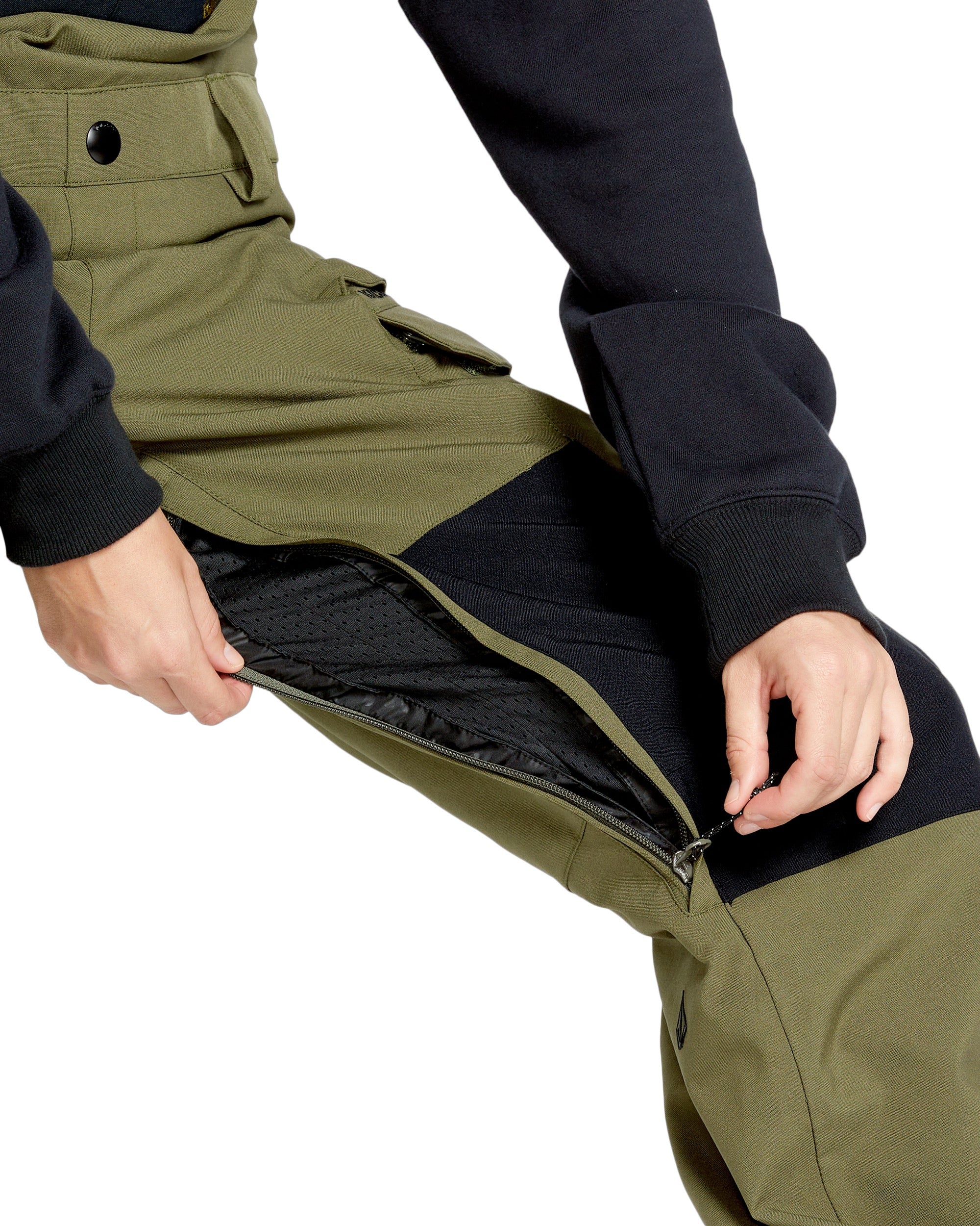 Volcom Women's Creston 3D Stretch Bib Overall - Olive green bib overalls with a black waistband and belt loops, featuring a zip fly and button front closure.