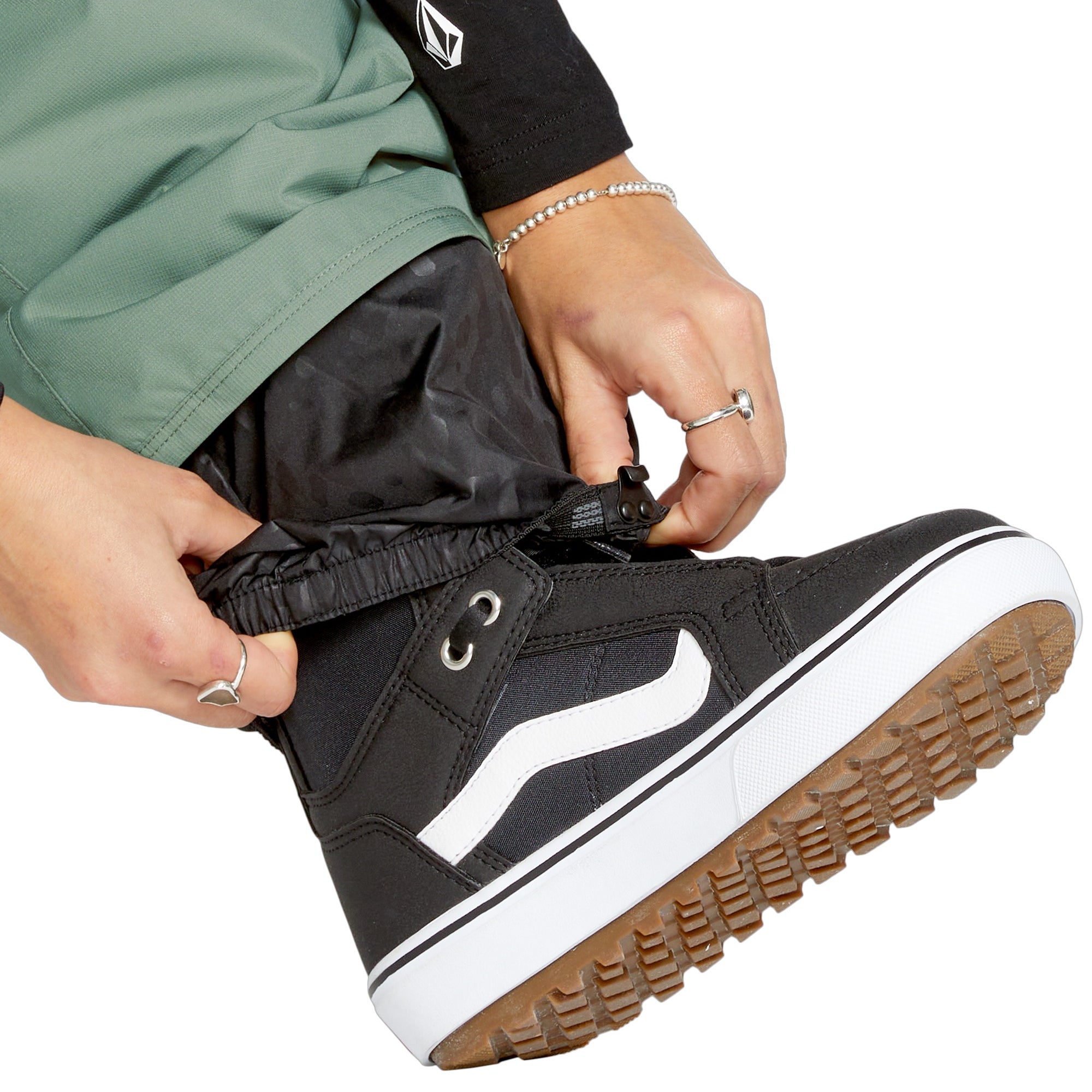 Volcom Women's Bridger Ins Pant - Black snowboard pants with a subtle pattern of small, dark gray dots on the upper thigh area.