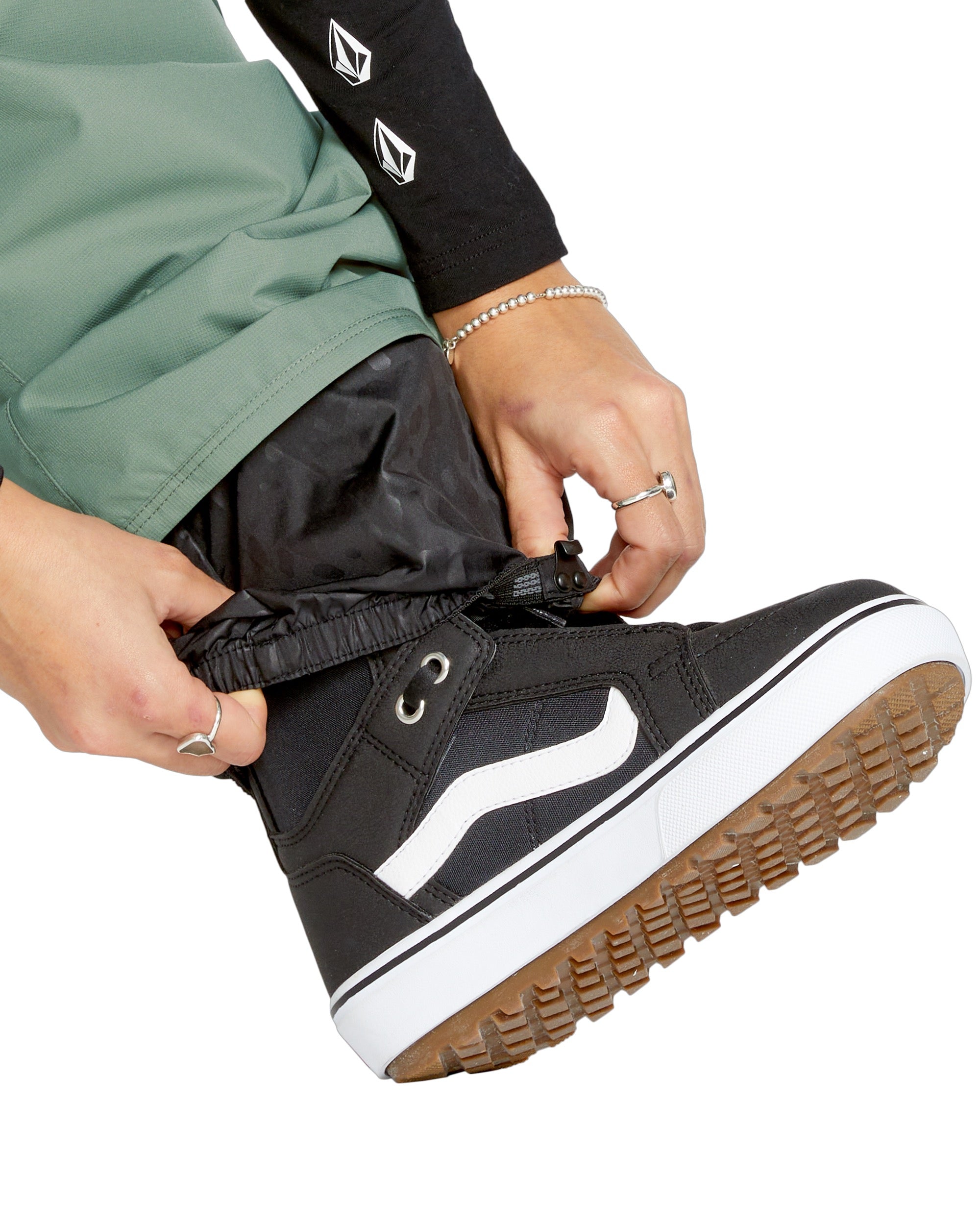 Volcom Women's Bridger Ins Pant - Black snowboard pants with a subtle pattern of small, dark gray dots on the upper thigh area.