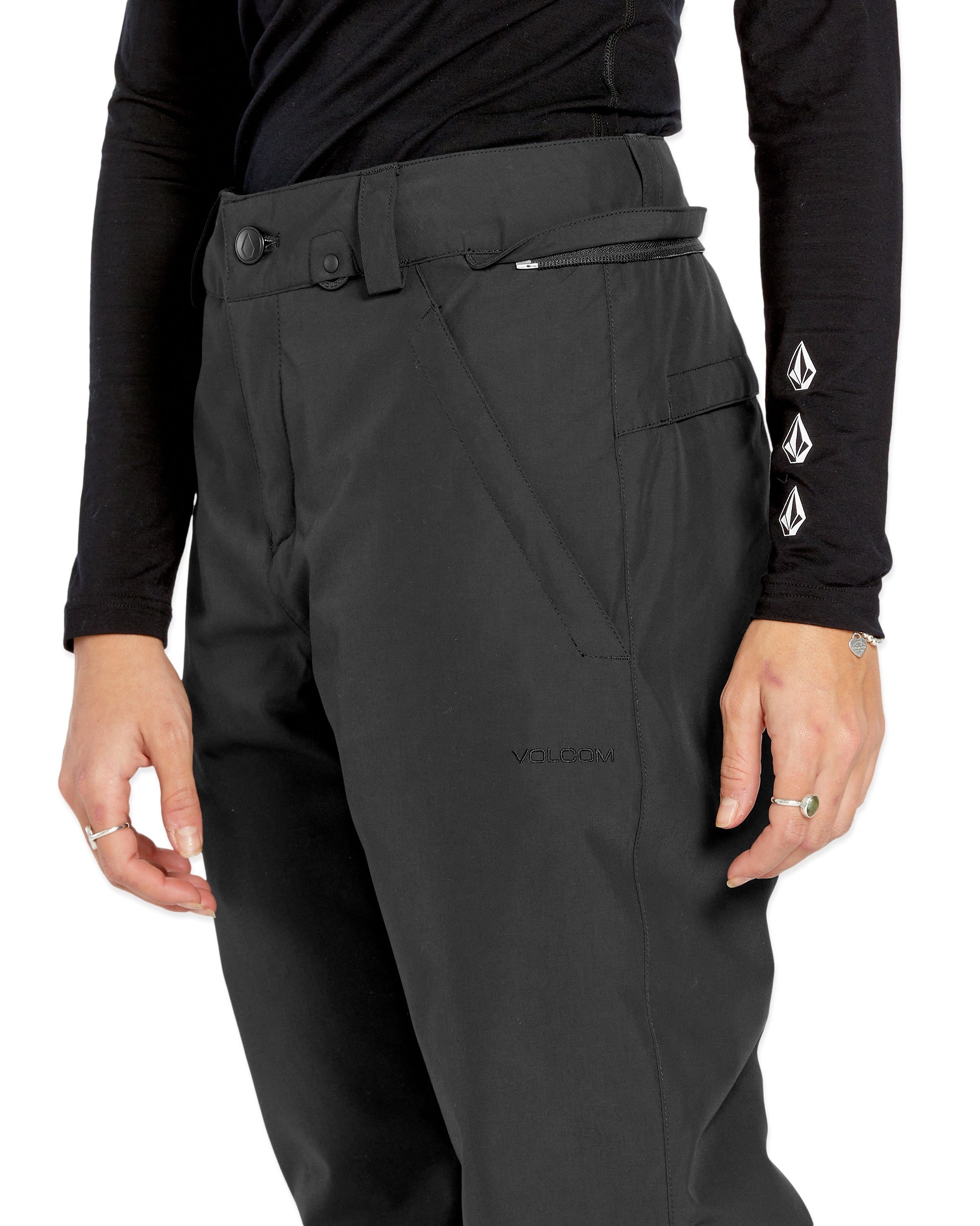 Volcom Women's Frochickie Insulated Pant - Black snow pants with a diagonal zippered pocket on the right thigh and a small black logo on the left leg.