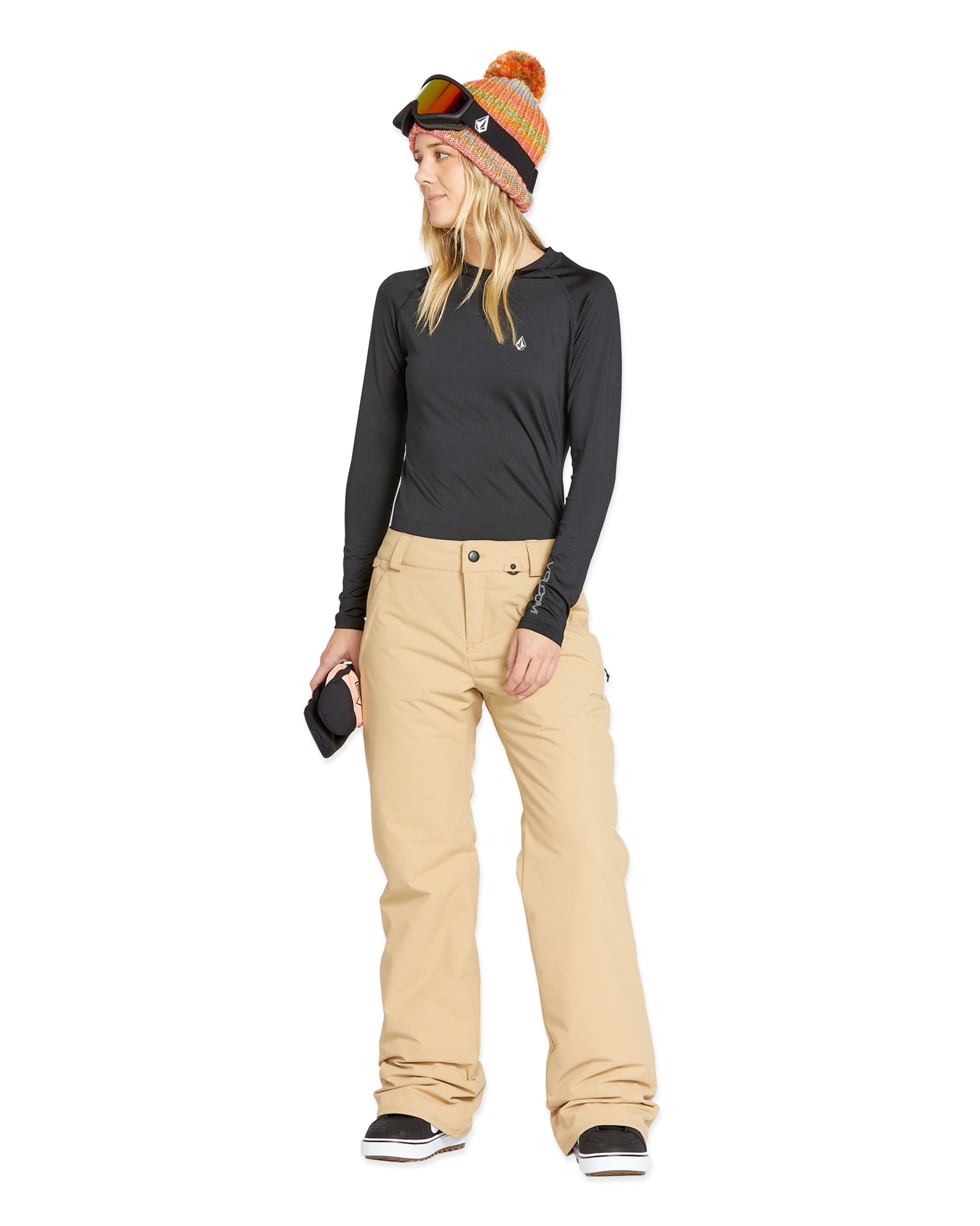 Volcom Women's Frochickie Insulated Pant - A pair of tan snow pants with a small white logo on the left thigh and a black zipper pull.