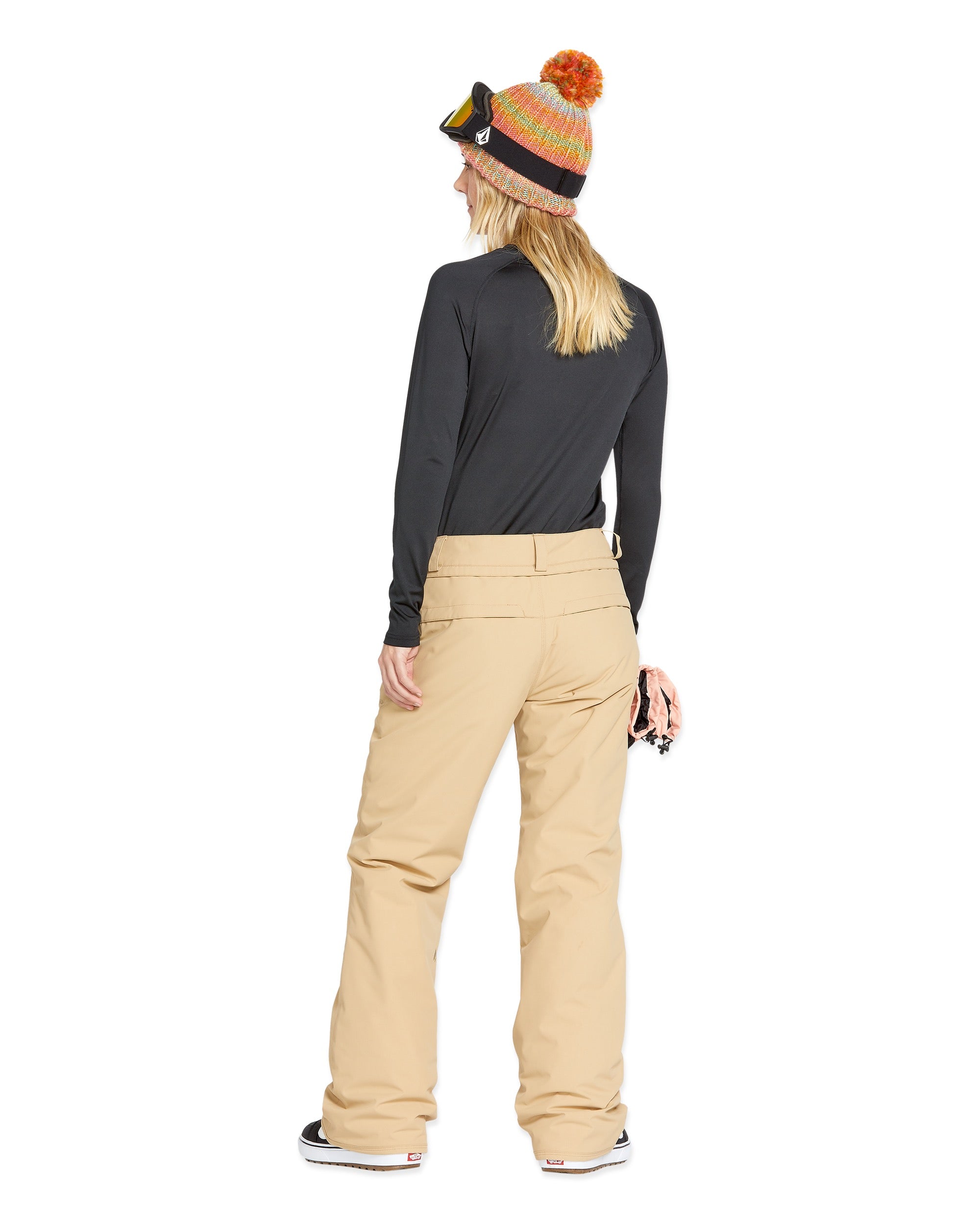 Volcom Women's Frochickie Insulated Pant - A pair of tan snow pants with a zippered pocket on the side and a drawstring at the waist.