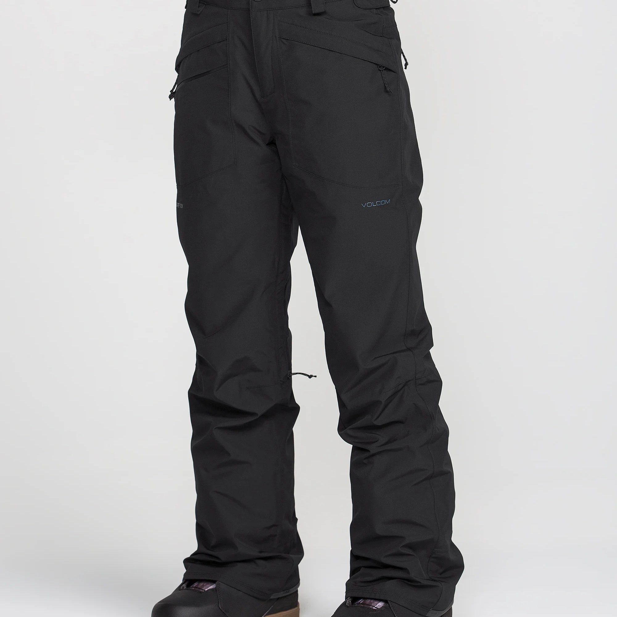 Women’s insulated GORE-TEX ski pants, black, side view with snap ankle gaiters