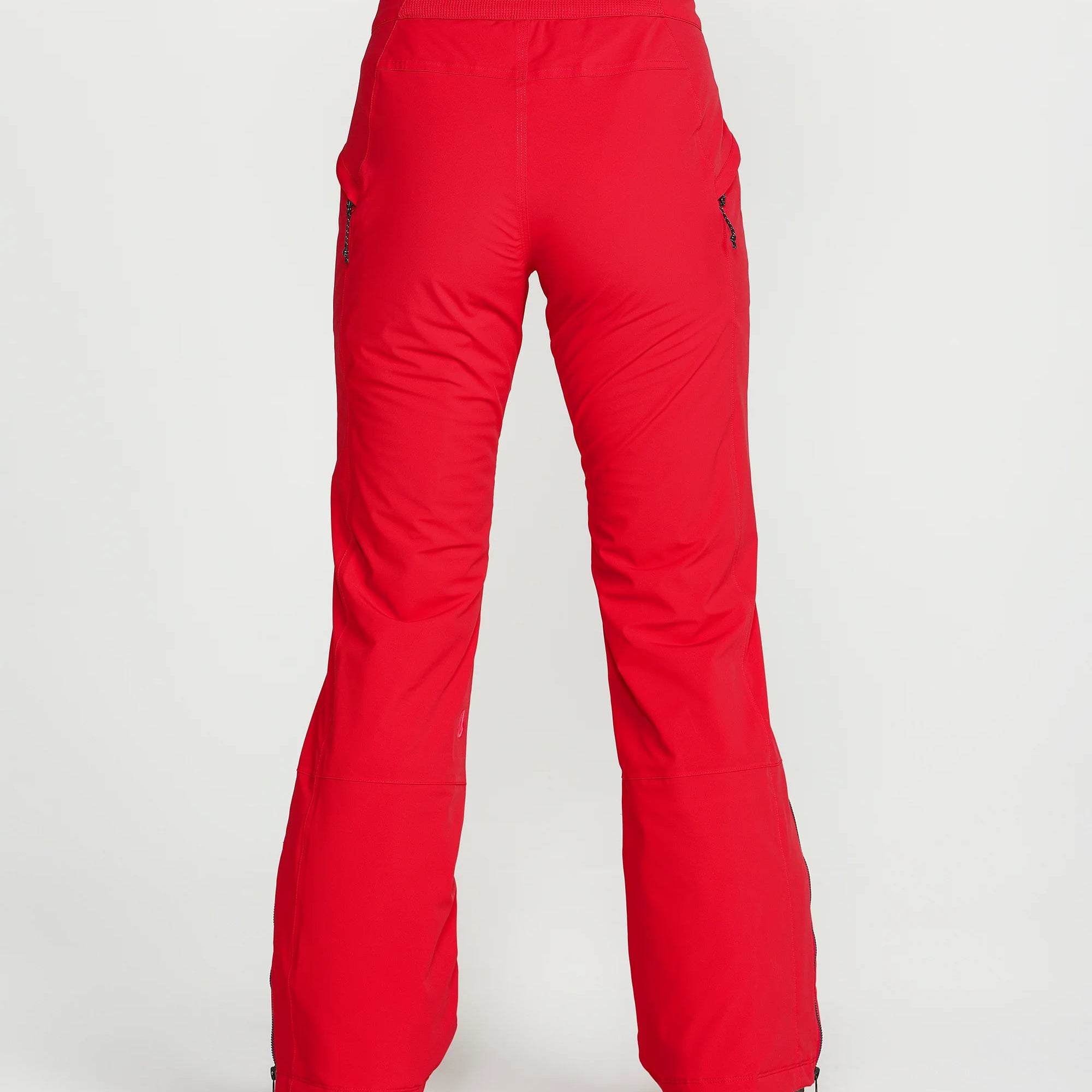 Red insulated ski pants with rear seam detail, side vents, and flared trouser hem.