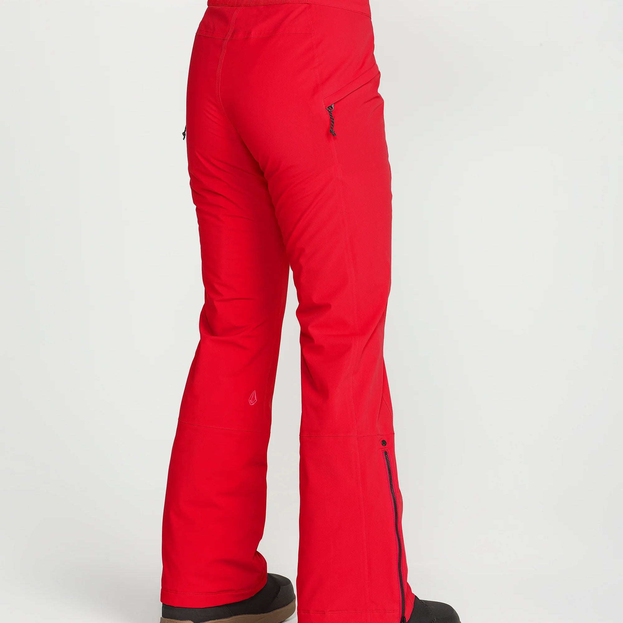 Red insulated ski pants, smooth side panels, wide boot openings with trim at hem.