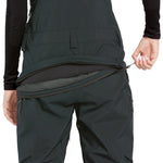 Volcom Women's Elm Stretch GORE-TEX Bib Overall - Black bib overall with a stretchy, dark-colored fabric and silver zippers on the side pockets.