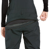 Volcom Women's Elm Stretch GORE-TEX Bib Overall - Black bib overall with a stretchy, dark-colored fabric and silver zippers on the side pockets.
