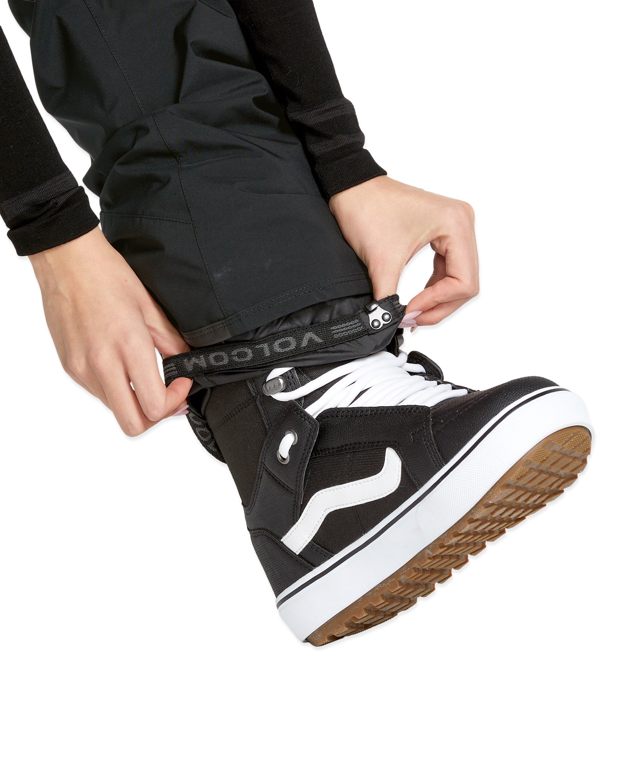 Volcom Women's - Black bib overall with white logo on left thigh and black zipper down front.