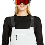 Volcom Women's Elm Stretch GORE-TEX Bib Overall - A pair of white snow pants with a black zipper and adjustable straps.