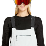 Volcom Women's Elm Stretch GORE-TEX Bib Overall - A pair of white snow pants with a black zipper and adjustable straps.