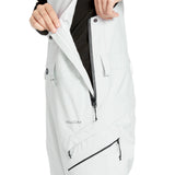 Volcom Women's Elm Stretch GORE-TEX Bib Overall - A white bib overall with a black logo on the left thigh and a black zipper running down the front.