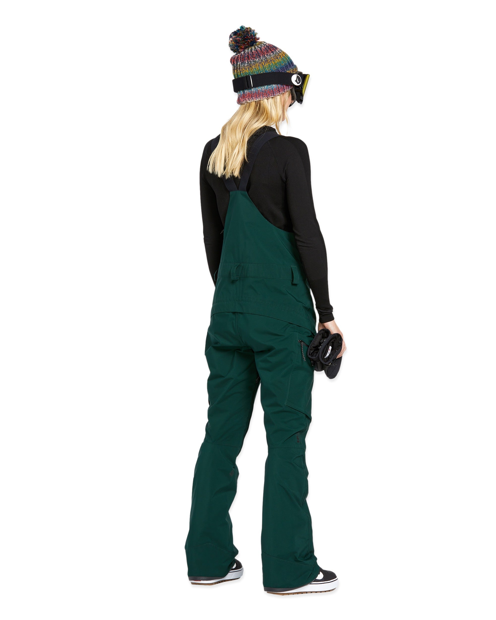 Volcom Women's Elm Stretch GORE-TEX Bib Overall - A pair of dark green snow pants with a stretchy material and multiple pockets, featuring a GORE-TEX logo on one pocket.