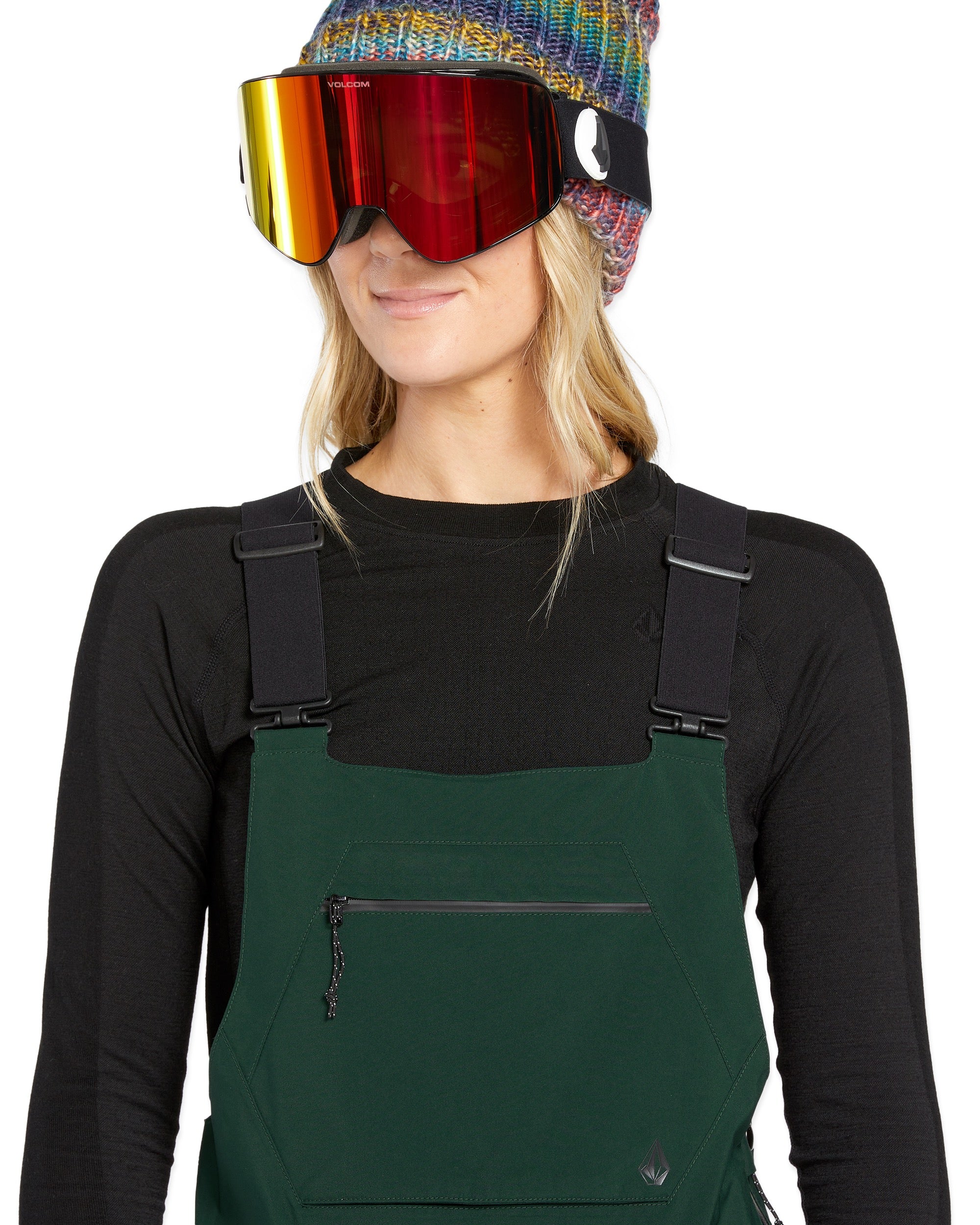 Volcom Women's Elm Stretch GORE-TEX Bib Overall - A pair of dark green snow pants with a zippered pocket on the thigh and adjustable straps at the waist.