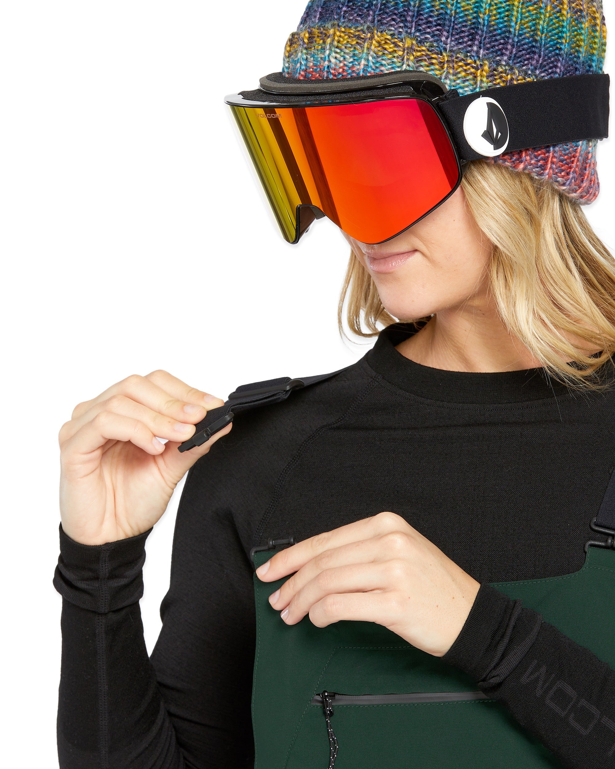 Volcom Women's Elm Stretch GORE-TEX Bib Overall - A pair of green snowboard pants with a stretchy material and a GORE-TEX logo on the left leg.