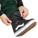 Volcom Women's Elm Stretch GORE-TEX Bib Overall - A pair of black waterproof overalls with a white logo on the left thigh and a zippered pocket on the right side.