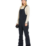 Volcom Women's Swift Bib Overall - Black bib overalls with zippered front and two side pockets.