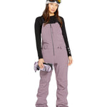 Volcom Women's Swift Bib Overall - A dusty rose bib overall with a zippered fly and two front pockets.