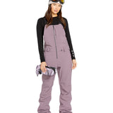Volcom Women's Swift Bib Overall - A dusty rose bib overall with a zippered fly and two front pockets.