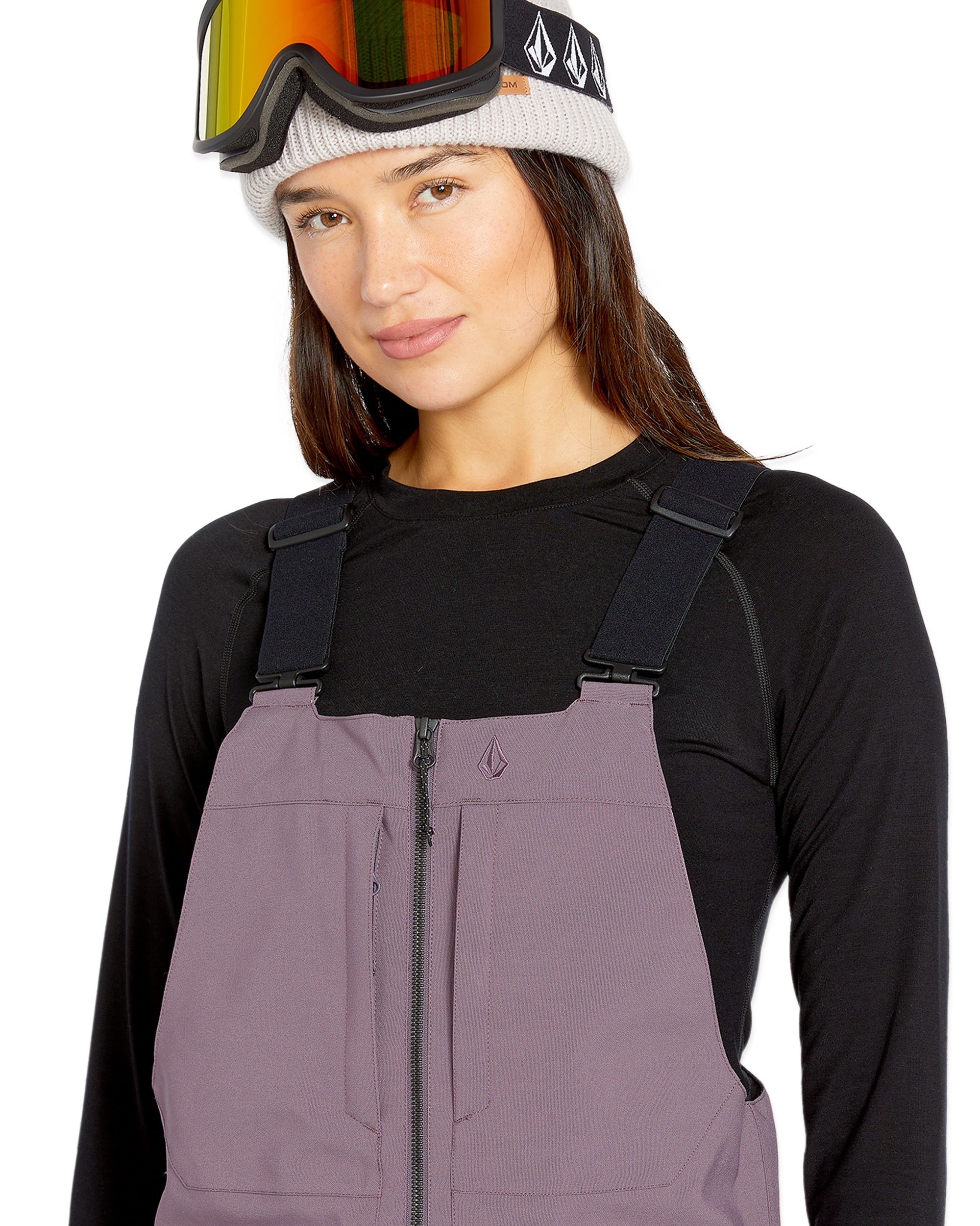 Volcom Women's Swift Bib Overall - A pair of bib overalls in a solid black color with adjustable straps and multiple pockets.