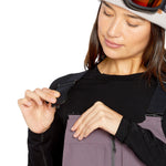 Volcom Women's Swift Bib Overall - A pair of bib overalls in a solid black color with zippered pockets and adjustable straps.