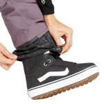 Volcom Women's Swift Bib Overall - A pair of black bib overalls with a subtle leopard print pattern on the waistband and pockets.