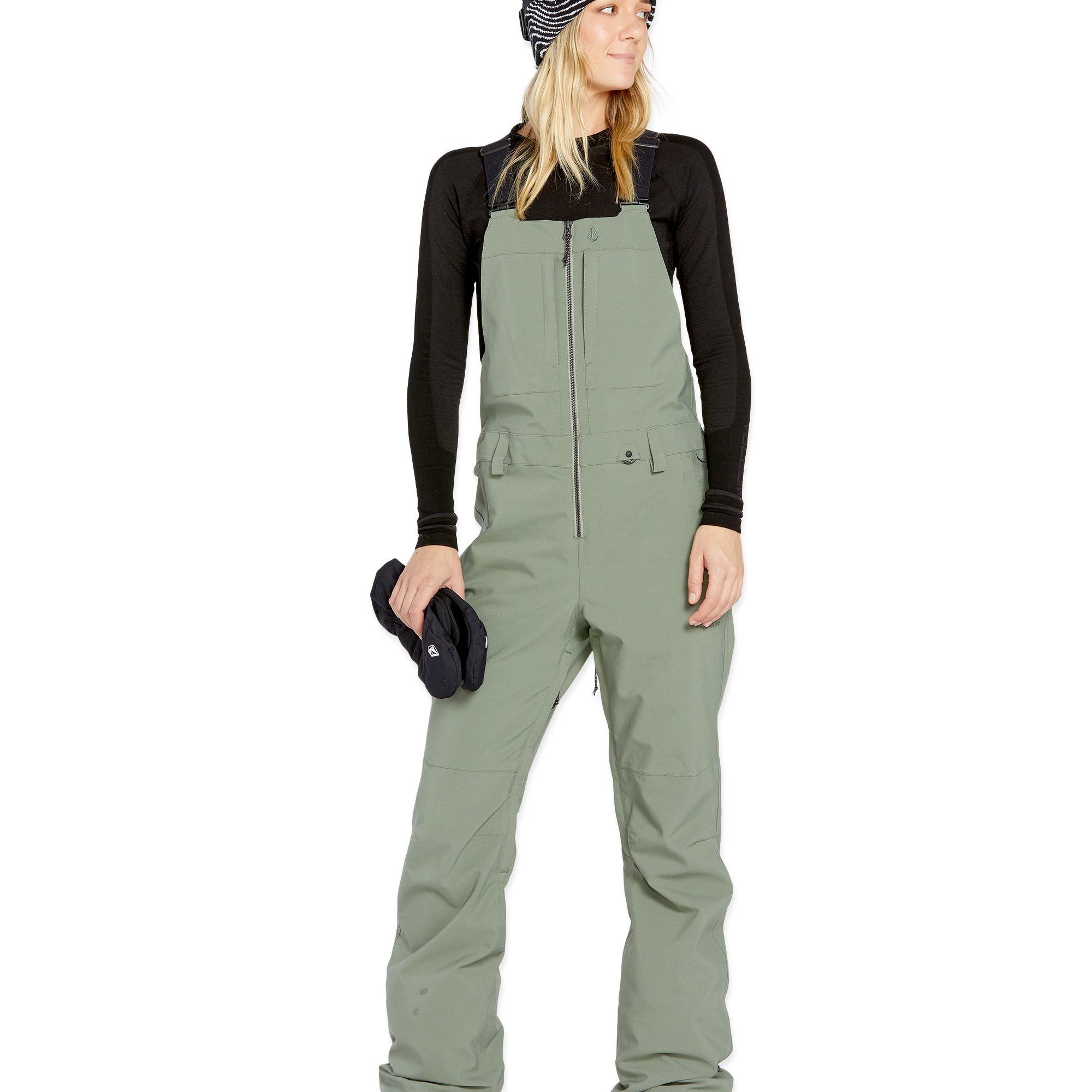 Volcom Women's Swift Bib Overall - A sage green bib overall with a zippered front and two side pockets, featuring a small white logo on the left thigh.